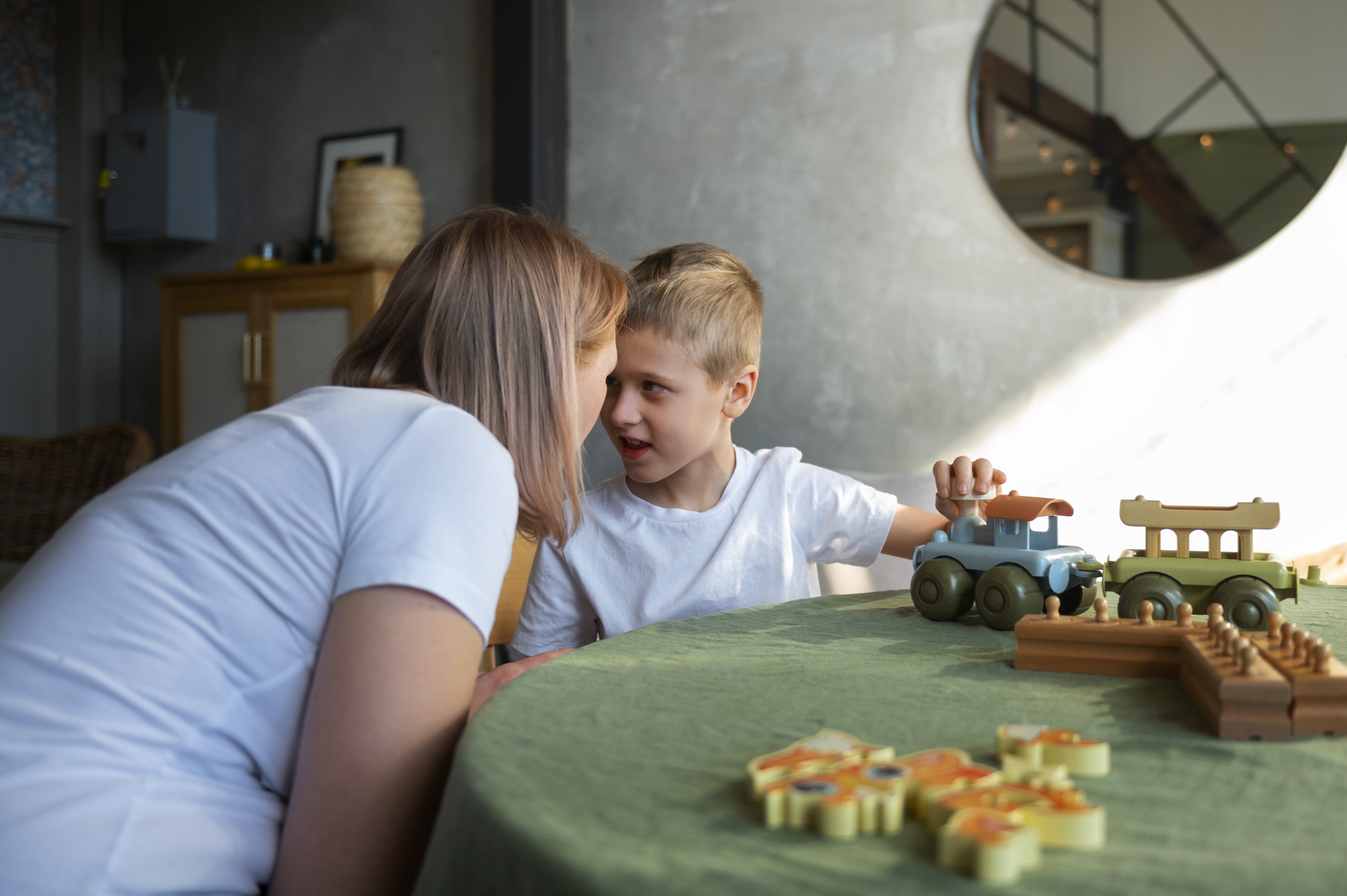 mother-playing-with-her-autistic-son-using-toys (1)-min